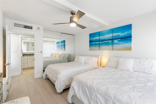 bedroom with ceiling fan and a closet