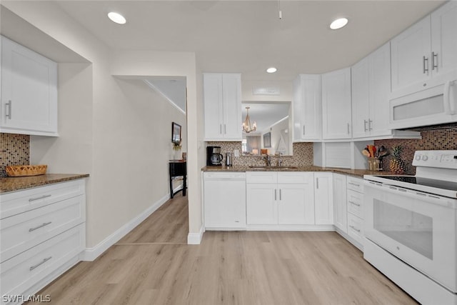 kitchen featuring light wood-type flooring, white appliances, and white cabinetry