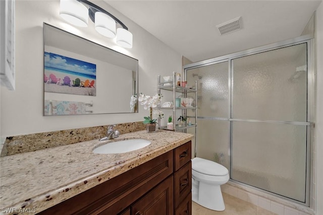 full bath featuring tile patterned flooring, toilet, vanity, visible vents, and a stall shower