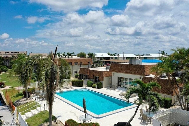 pool featuring a patio area and fence