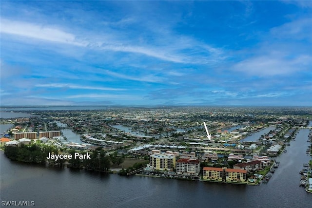 birds eye view of property featuring a water view and a city view