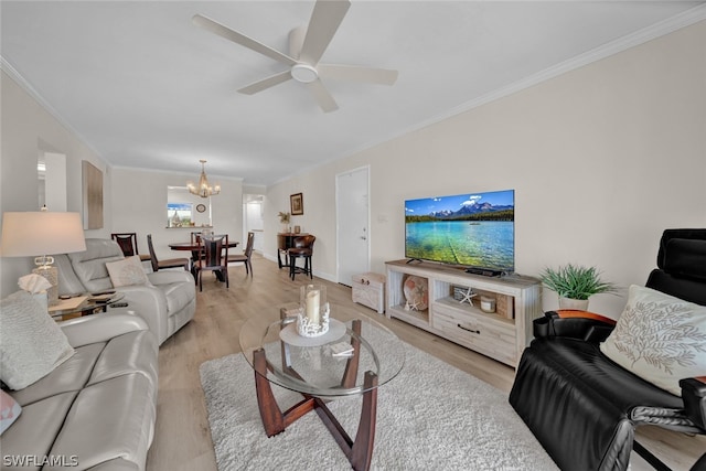 living room featuring crown molding, light hardwood / wood-style floors, and ceiling fan with notable chandelier