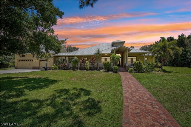 view of front of property with a yard