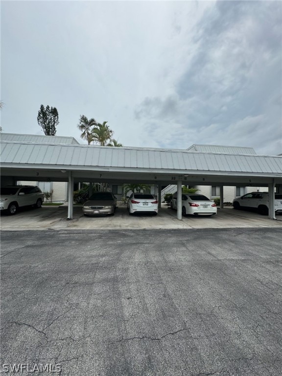 view of vehicle parking with a carport