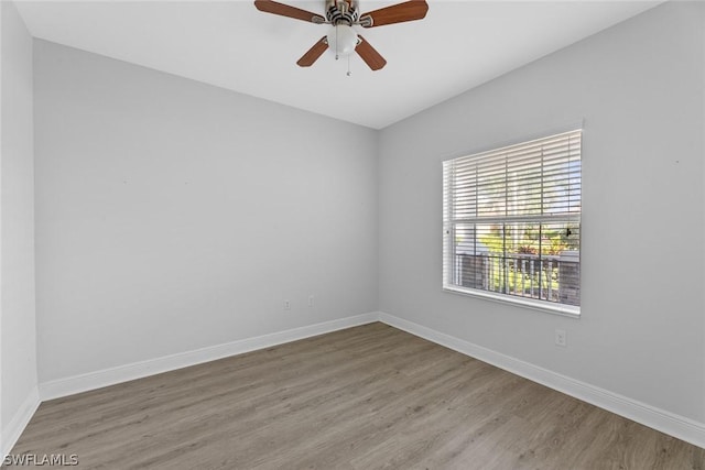 empty room featuring ceiling fan and light hardwood / wood-style flooring