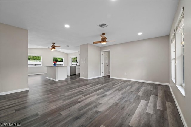 unfurnished living room featuring recessed lighting, dark wood-style flooring, visible vents, and baseboards