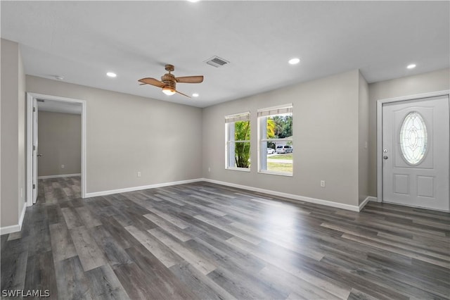 foyer entrance featuring recessed lighting, dark wood-style flooring, visible vents, and baseboards