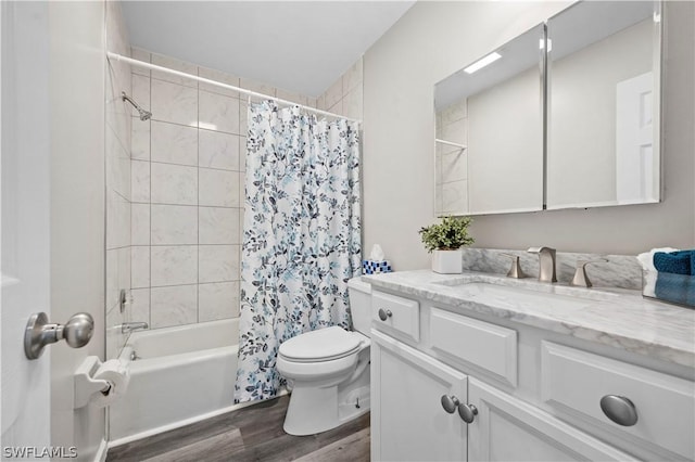 bathroom featuring vanity, shower / bath combo, wood finished floors, and toilet