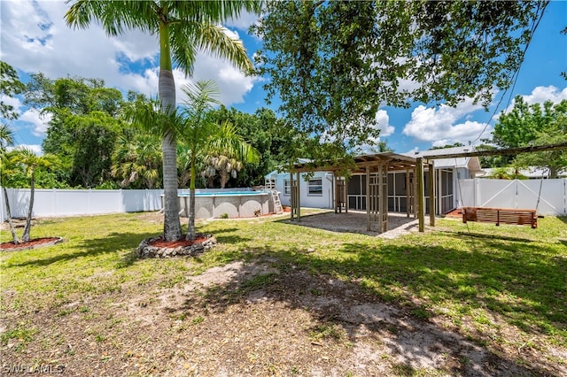 view of yard with a patio area, a fenced backyard, and a fenced in pool