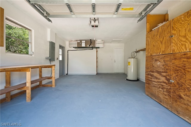 garage featuring electric panel, water heater, and a garage door opener