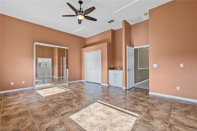 unfurnished room featuring ceiling fan