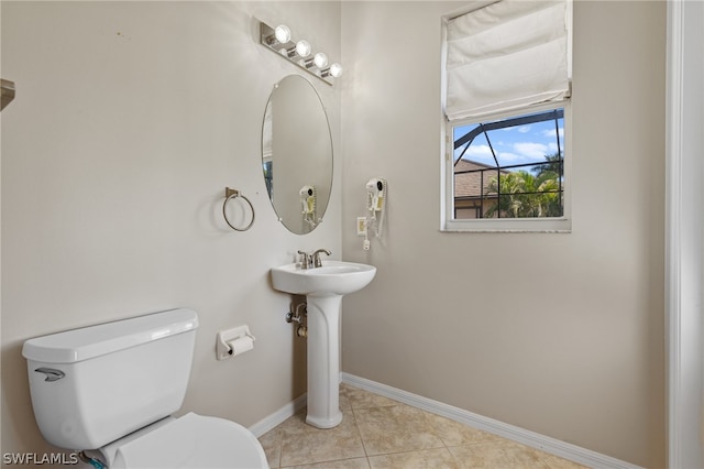 bathroom featuring tile patterned flooring and toilet