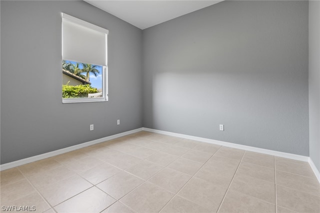 unfurnished room with light tile patterned floors