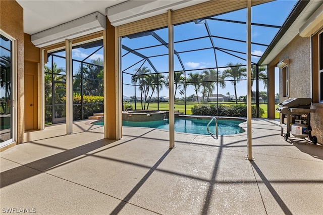 view of pool with an in ground hot tub, a patio, and glass enclosure