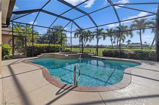 view of pool featuring a lanai, a patio area, and an in ground hot tub