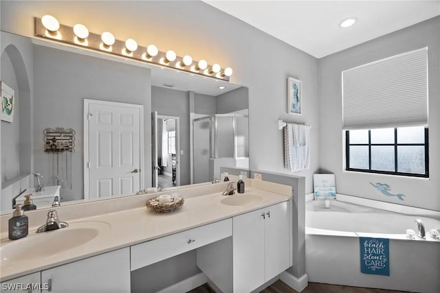bathroom featuring vanity and plus walk in shower