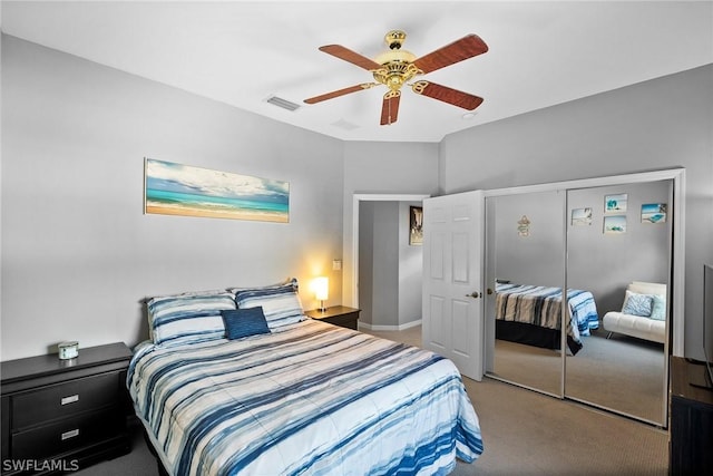 bedroom with carpet, a closet, and ceiling fan
