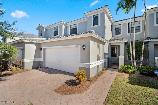 mediterranean / spanish house featuring a garage