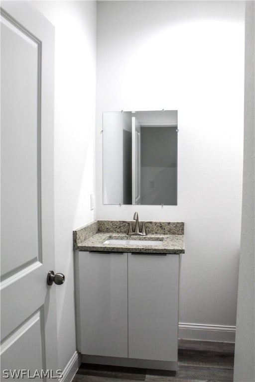 bathroom featuring wood-type flooring and vanity