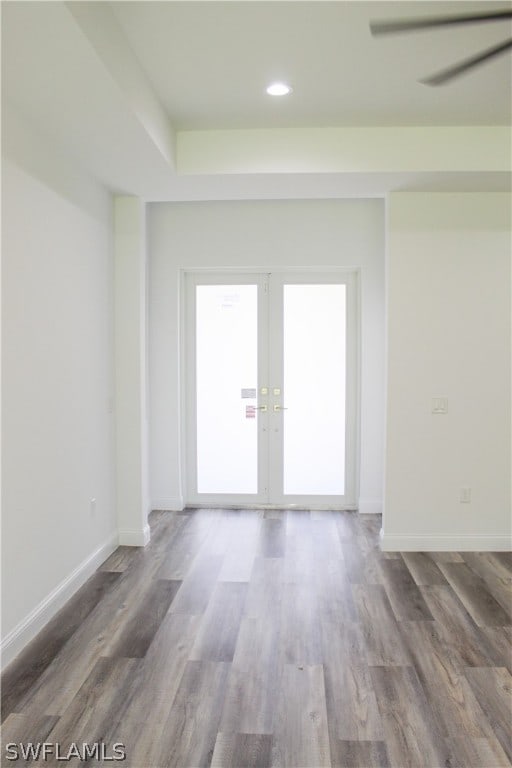 empty room featuring hardwood / wood-style floors and french doors