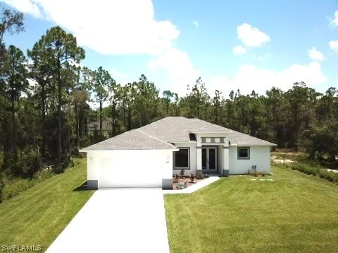 view of front facade featuring a front yard and a garage