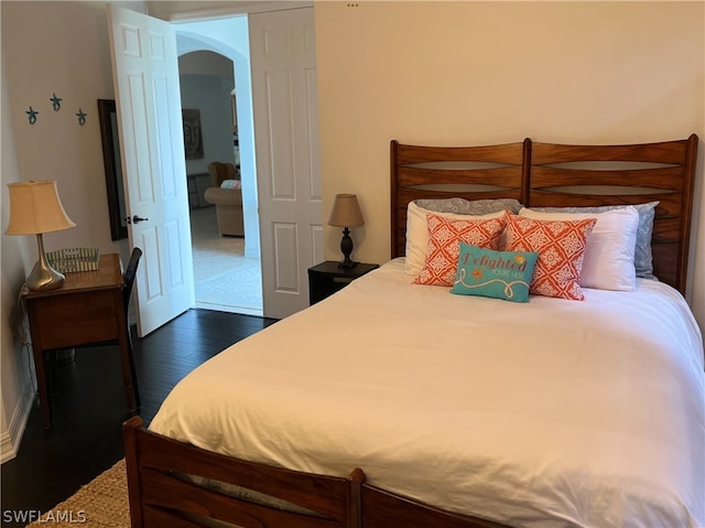 bedroom featuring dark hardwood / wood-style floors