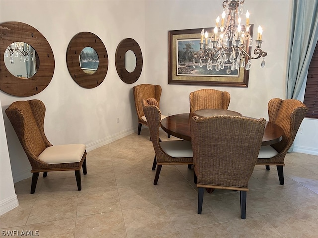 dining space with light tile patterned floors and a notable chandelier