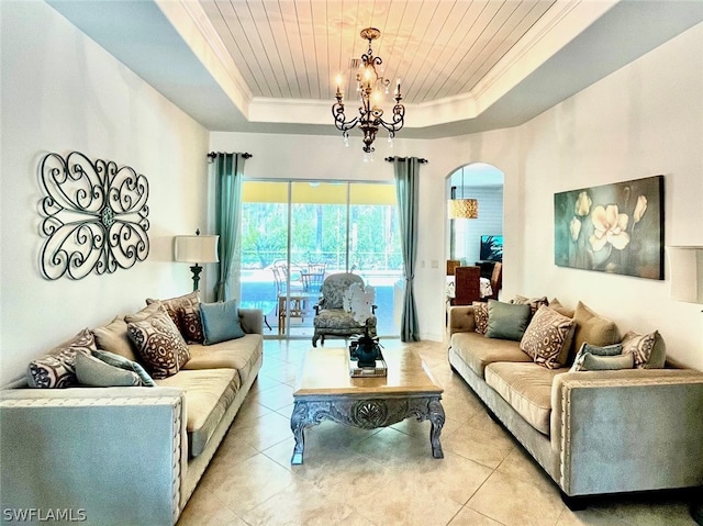 tiled living room featuring an inviting chandelier, wooden ceiling, crown molding, and a tray ceiling