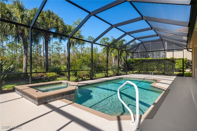 view of swimming pool featuring glass enclosure, an in ground hot tub, and a patio area