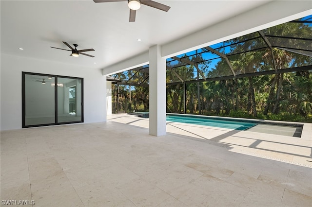 view of pool featuring a lanai, ceiling fan, and a patio