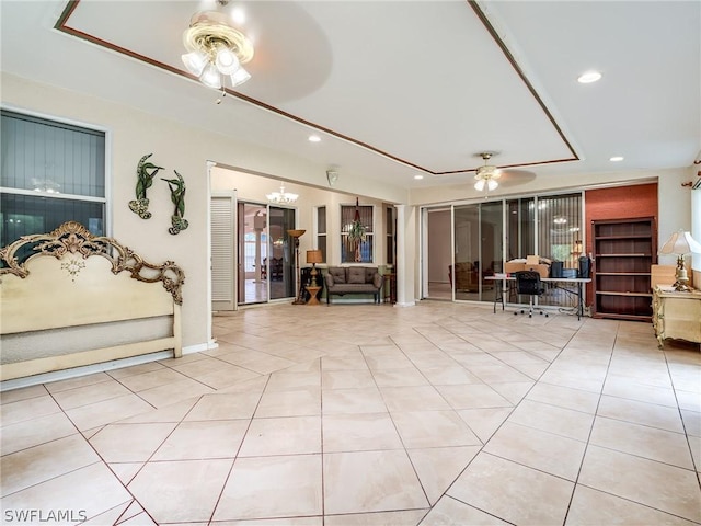 living room with ceiling fan and light tile patterned floors