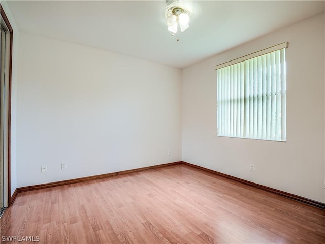 spare room with light hardwood / wood-style floors