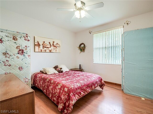 bedroom featuring ceiling fan and wood-type flooring