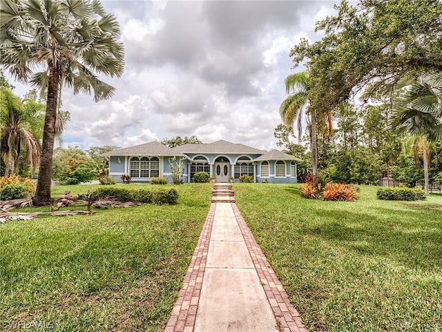 single story home with a front yard