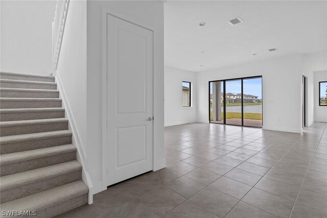 staircase with tile patterned flooring