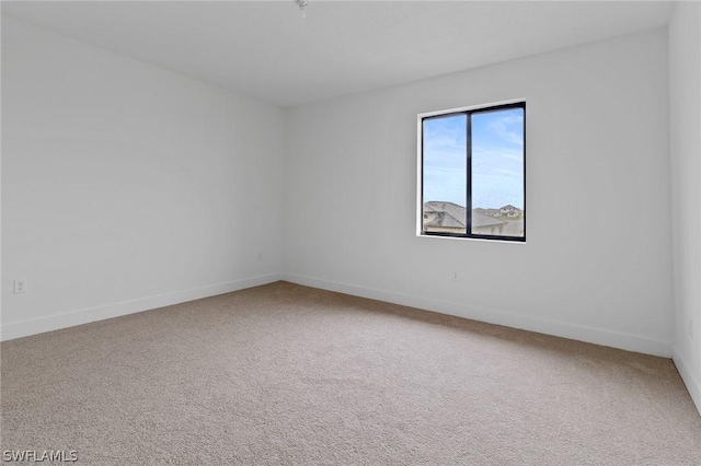 unfurnished room featuring carpet flooring