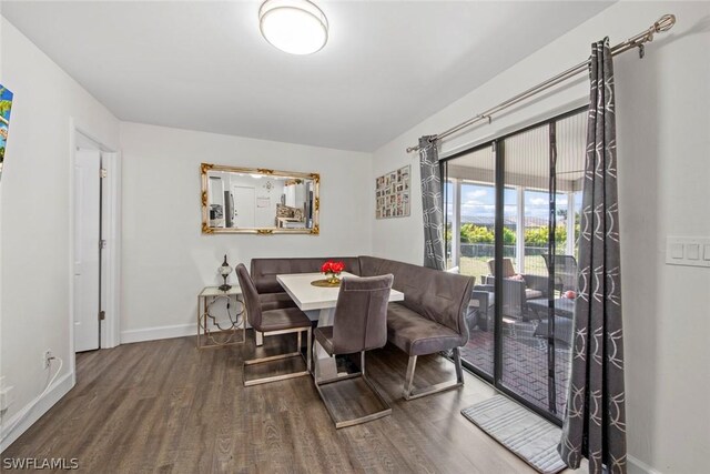 dining space with hardwood / wood-style floors