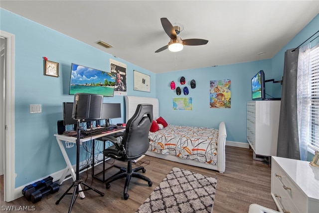 bedroom featuring ceiling fan and hardwood / wood-style floors