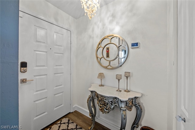 entryway featuring a notable chandelier and hardwood / wood-style floors