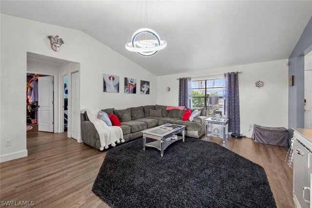 living room with wood-type flooring and lofted ceiling