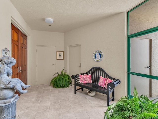 foyer with a textured ceiling