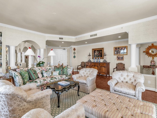 living room featuring ornamental molding and decorative columns