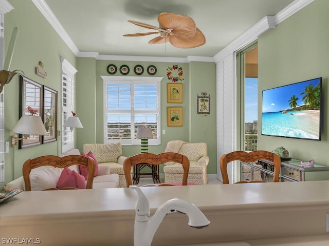 interior space featuring ceiling fan and crown molding