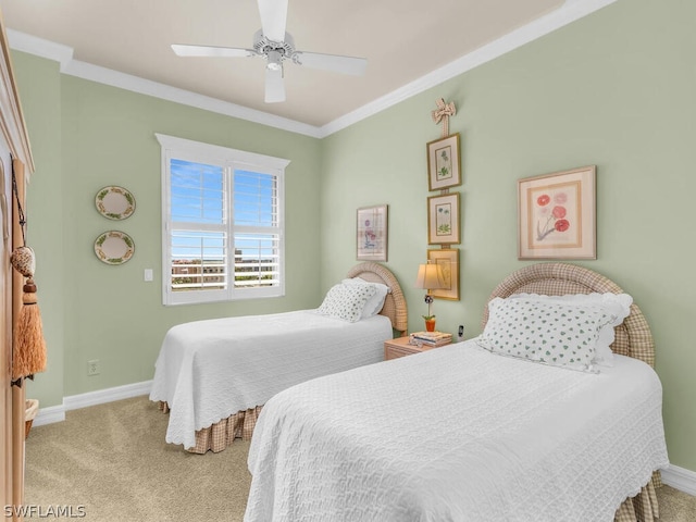 carpeted bedroom featuring ceiling fan and ornamental molding