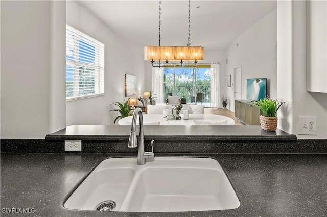 kitchen featuring decorative light fixtures and sink