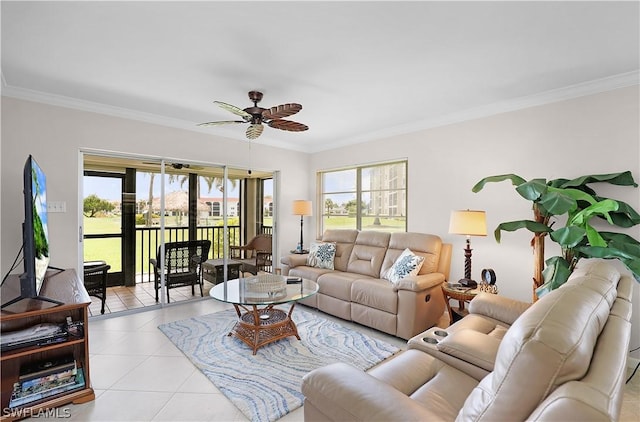 tiled living room featuring ornamental molding, ceiling fan, and a healthy amount of sunlight