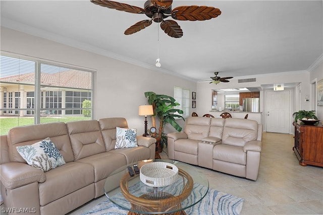 tiled living room featuring crown molding