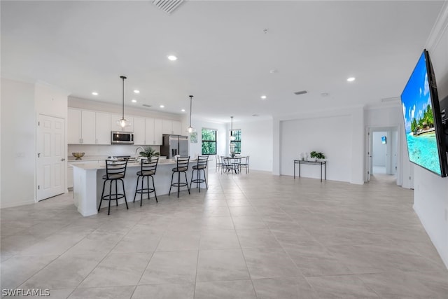 2375 Montserrat Ln Unit 202, Naples, FL 34120 - kitchen featuring stainless steel appliances, recessed lighting, a large island, and visible vents