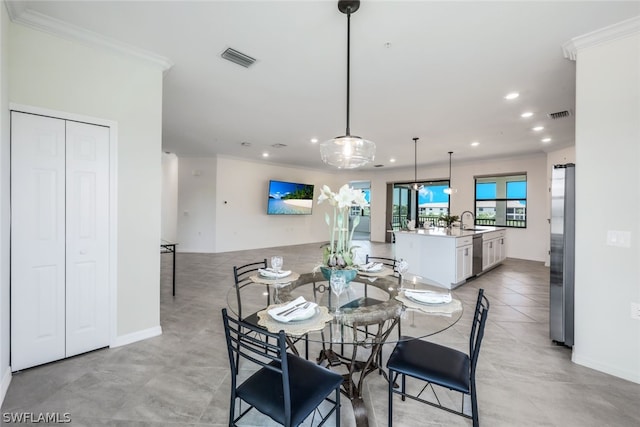 2375 Montserrat Ln Unit 202, Naples, FL 34120 - dining room with crown molding, recessed lighting, and visible vents