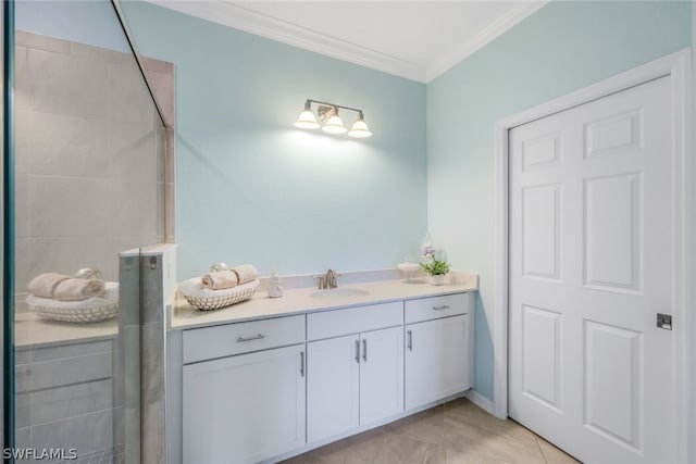 bathroom featuring tile patterned floors, vanity, crown molding, and walk in shower